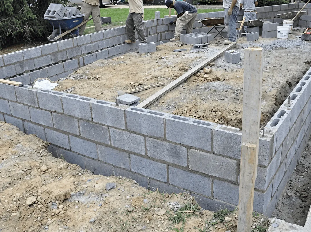 Professionals building a foundation with blocks in Akron, OH