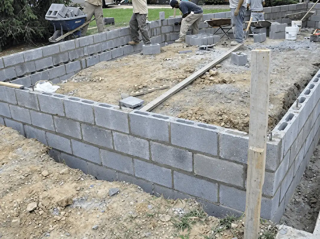 Professionals building a foundation with blocks in Akron, OH