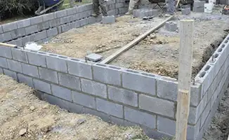 Professionals building a foundation with blocks in Akron, OH