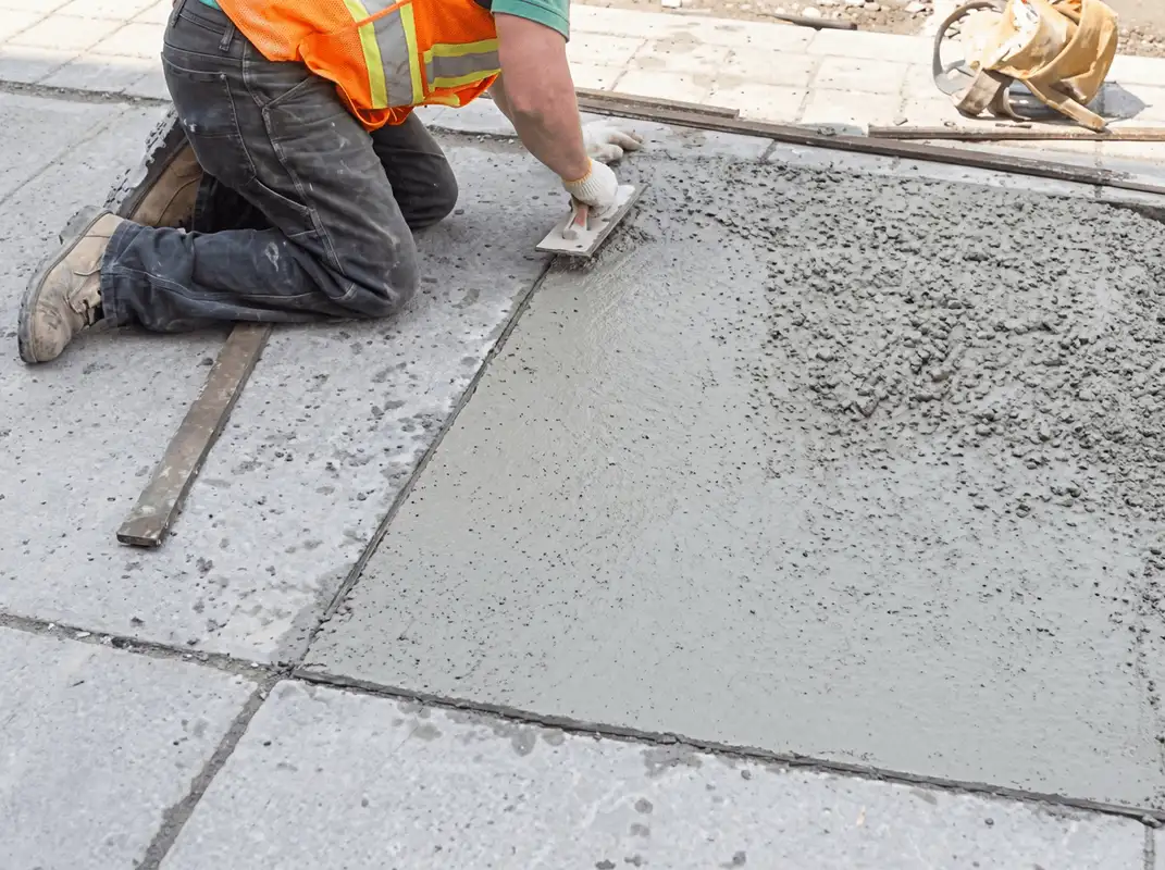 Professional repairing a concrete floor in Akron, OH