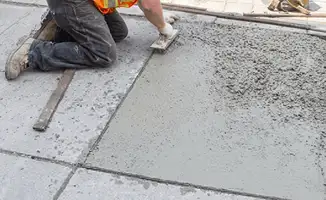 Professional repairing a concrete floor in Akron, OH